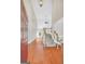 Open foyer with hardwood floors, staircase, and high ceilings, creating a bright and welcoming entrance at 1315 Crane Ct, Mcdonough, GA 30252