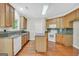 Charming kitchen features granite counters, an island, and modern appliances at 1315 Crane Ct, Mcdonough, GA 30252
