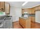 Well-lit kitchen featuring granite counters, an island, and stainless appliances at 1315 Crane Ct, Mcdonough, GA 30252