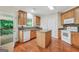 Bright kitchen features granite counters, an island, and access to an outdoor deck at 1315 Crane Ct, Mcdonough, GA 30252