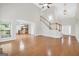 Open concept living room with hardwood floors leading to the kitchen and staircase, great for entertaining at 1315 Crane Ct, Mcdonough, GA 30252