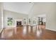 Spacious living room with hardwood floors, fireplace, and bright windows, offering a comfortable and inviting atmosphere at 1315 Crane Ct, Mcdonough, GA 30252