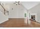 Spacious living room boasts hardwood floors, a fireplace, and lots of natural light at 1315 Crane Ct, Mcdonough, GA 30252