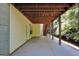 Covered patio with wooden ceiling and staircase, perfect for outdoor relaxation and entertaining at 1315 Crane Ct, Mcdonough, GA 30252