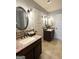 Bathroom with dual sinks, framed mirrors, and decorative backsplash tiling at 1869 Schofield Dr, Hampton, GA 30228