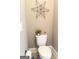 Powder room features a standard toilet with updated decor and gray paint at 1869 Schofield Dr, Hampton, GA 30228