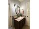 Bathroom with modern vanity, framed mirror, and stylish mosaic backsplash tiling at 1869 Schofield Dr, Hampton, GA 30228
