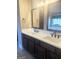 Elegant bathroom vanity with dual sinks, modern faucets, and stylish mirrors at 1869 Schofield Dr, Hampton, GA 30228