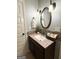 This bathroom features a modern vanity, granite countertop, and updated fixtures at 1869 Schofield Dr, Hampton, GA 30228