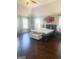A bright bedroom showcases hardwood floors, high ceilings, and a large bed at 1869 Schofield Dr, Hampton, GA 30228