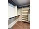Walk-in closet with built-in shelving and hanging racks for clothes and other belongings at 1869 Schofield Dr, Hampton, GA 30228