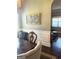 Bright dining area showcasing wainscoting and decor with an open view to the living room at 1869 Schofield Dr, Hampton, GA 30228