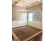 Dining room featuring decorative chandelier, neutral paint and trim, and large rug at 1869 Schofield Dr, Hampton, GA 30228