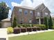 A spacious home with brick and stone accents is complemented by lush landscaping and a convenient two-car garage at 1869 Schofield Dr, Hampton, GA 30228
