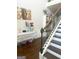 A foyer showcases a staircase, polka-dot table, artwork and shelving at 1869 Schofield Dr, Hampton, GA 30228