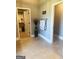 Open hallway leads to walk in closet and rooms in the home at 1869 Schofield Dr, Hampton, GA 30228