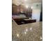 Granite countertops and stainless steel appliances accent this beautiful kitchen space at 1869 Schofield Dr, Hampton, GA 30228