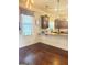 Bright kitchen showcasing granite countertops, mosaic backsplash, hardwood floors, and modern appliances at 1869 Schofield Dr, Hampton, GA 30228