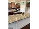 Gourmet kitchen featuring granite countertops, stainless steel appliances, and a spacious island at 1869 Schofield Dr, Hampton, GA 30228