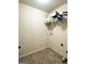 The laundry room features tile flooring and a shelf for storage and organization at 1869 Schofield Dr, Hampton, GA 30228
