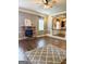 Elegant living room features hardwood floors, a stone fireplace, and an open layout perfect for entertaining at 1869 Schofield Dr, Hampton, GA 30228