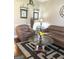 A living room featuring a coffee table, plush sofas, decorative rug and a large clock at 1869 Schofield Dr, Hampton, GA 30228