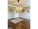 Spacious living room with hardwood floors, neutral paint, and decorative ceiling fan at 1869 Schofield Dr, Hampton, GA 30228