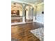 Spacious living room with hardwood floors and arched doorways leads to a well-appointed kitchen at 1869 Schofield Dr, Hampton, GA 30228