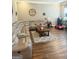 Cozy living room featuring hardwood floors, a plush sectional sofa, and a decorative coffee table at 1869 Schofield Dr, Hampton, GA 30228