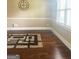 Bright room featuring hardwood floors, neutral paint and trimwork at 1869 Schofield Dr, Hampton, GA 30228