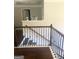 Upper landing featuring an open view, decorative railing, and hardwood floors at 1869 Schofield Dr, Hampton, GA 30228