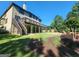 Exterior home view with large deck overlooking landscaped backyard and lawn at 4818 Moon Hollow Ct, Buford, GA 30519