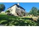 Exterior with upper deck and covered patio overlooking landscaped yard and lawn at 4818 Moon Hollow Ct, Buford, GA 30519