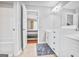 Bathroom with white cabinets, double vanity sinks, and tile flooring at 4818 Moon Hollow Ct, Buford, GA 30519