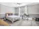 Bedroom featuring carpet, gray walls, a window, and a queen sized bed with neutral colored bedding at 4818 Moon Hollow Ct, Buford, GA 30519