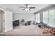 Spacious bonus room with carpet, multiple windows, and ceiling fan at 4818 Moon Hollow Ct, Buford, GA 30519