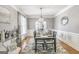 Charming dining room with stylish decor and ample seating for formal gatherings at 4818 Moon Hollow Ct, Buford, GA 30519