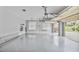 Spacious garage with epoxy flooring, overhead doors, and shelving, providing ample storage and parking space at 4818 Moon Hollow Ct, Buford, GA 30519