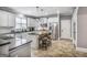 Well-equipped kitchen with stainless appliances and center island with bar stool seating at 4818 Moon Hollow Ct, Buford, GA 30519