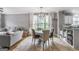 Open living room with dining area features tile floors and lots of natural light at 4818 Moon Hollow Ct, Buford, GA 30519