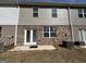 Backyard with small patio, an AC unit, and brick and siding exterior at 190 Hampton Cir, Mcdonough, GA 30253