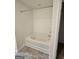 Bathroom featuring a bathtub with a showerhead, tiled flooring, and a neutral color scheme at 190 Hampton Cir, Mcdonough, GA 30253