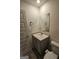Half bathroom with a mirror, sink, and toilet at 190 Hampton Cir, Mcdonough, GA 30253