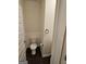 Cozy powder room featuring essential fixtures, including a toilet, and a towel ring at 190 Hampton Cir, Mcdonough, GA 30253
