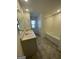 Bright bathroom featuring double sinks, tile floors, and a tub with shower combination at 190 Hampton Cir, Mcdonough, GA 30253