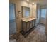 Bathroom featuring double sinks, neutral color scheme, and tiled floors at 190 Hampton Cir, Mcdonough, GA 30253