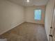 Neutral bedroom with a window that provides natural light at 190 Hampton Cir, Mcdonough, GA 30253