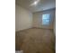 Cozy bedroom with neutral carpet, a window for natural light, and fresh, bright paint at 190 Hampton Cir, Mcdonough, GA 30253