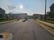View of the gated townhome community featuring professionally maintained landscaping and sidewalks at 190 Hampton Cir, Mcdonough, GA 30253