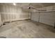 Unfinished garage with concrete floors and a garage door at 190 Hampton Cir, Mcdonough, GA 30253
